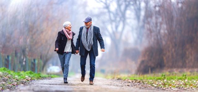 Retired Couple Walking on a Road